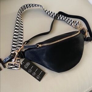 Black faux leather belt sling bag by INC